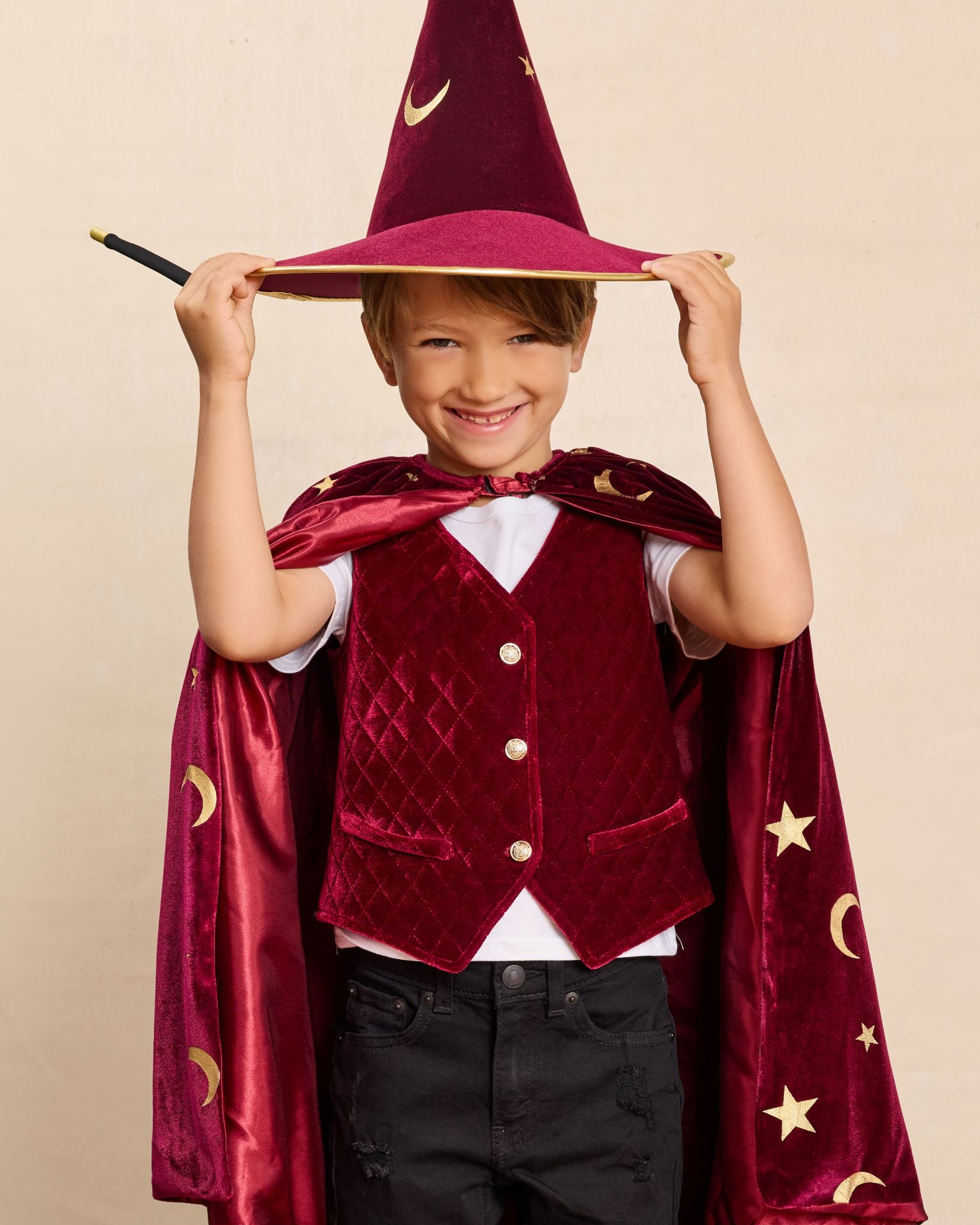 Boy wearing a red wizard costume with a hat and cape - Best Kids Magician Costumes and Dress Up