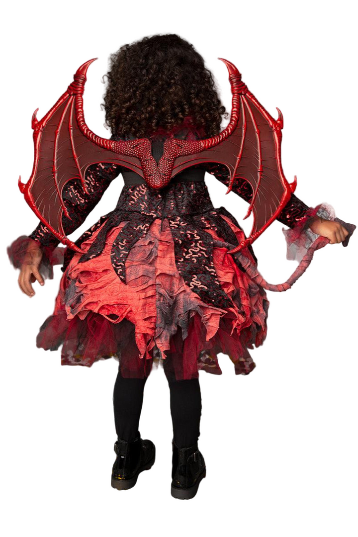 Child wearing a red and black dragon costume with wings and tail.