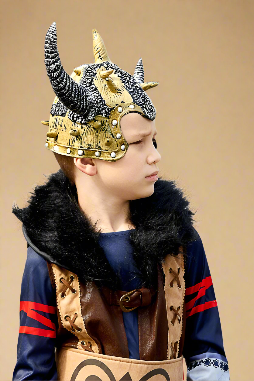 Child wearing a detailed warrior costume with a helmet on a white background