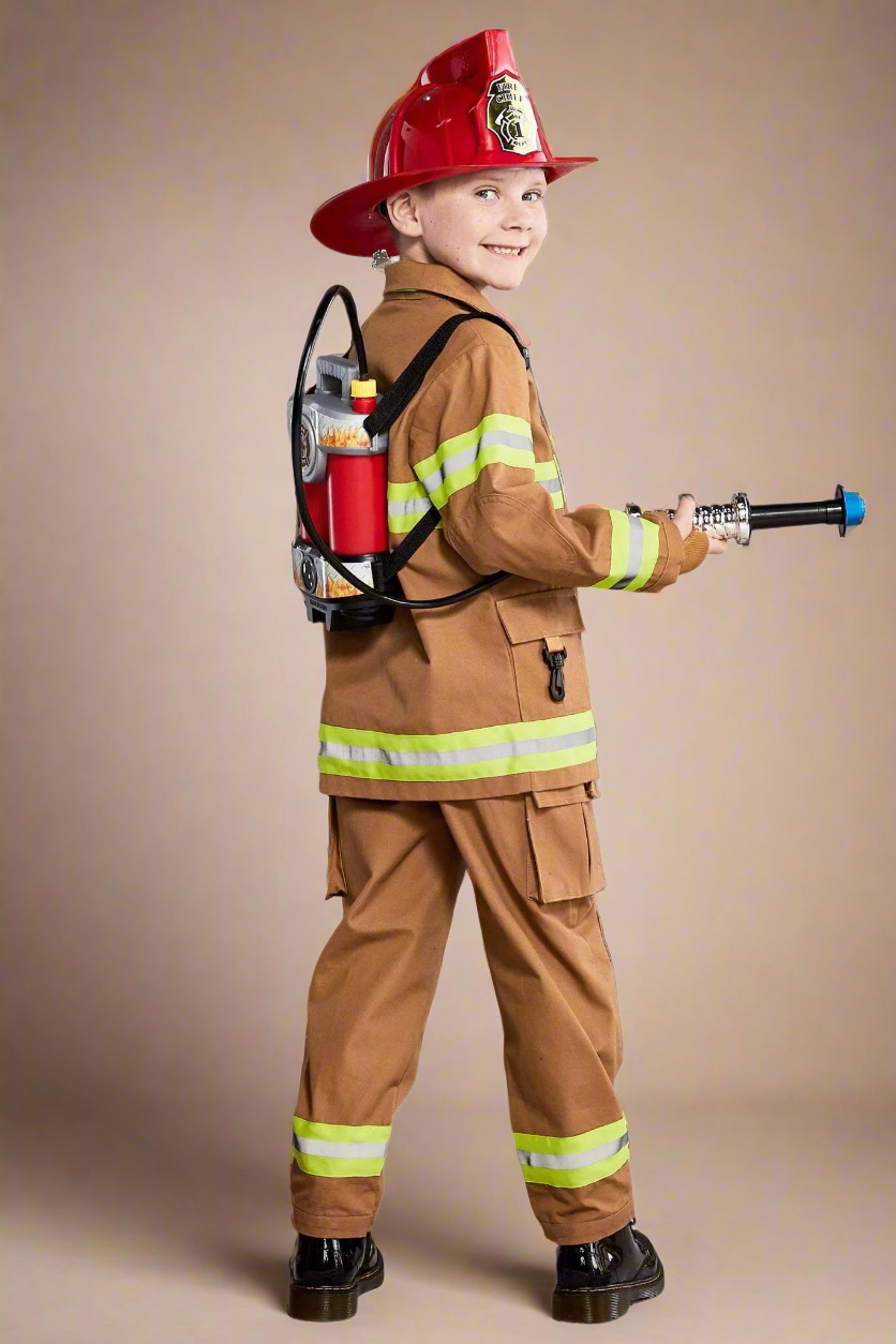 Child wearing a firefighter costume with a helmet and backpack on a white background