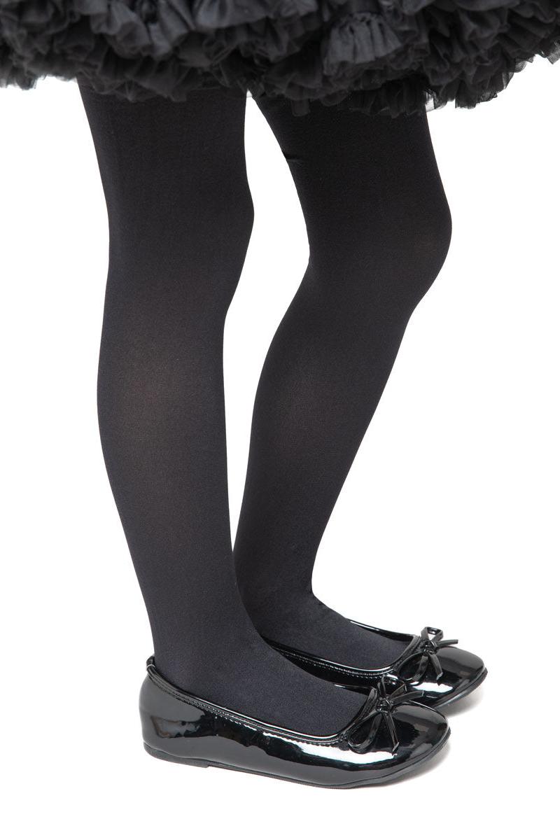 Black tights and shoes worn with a black tutu on a white background